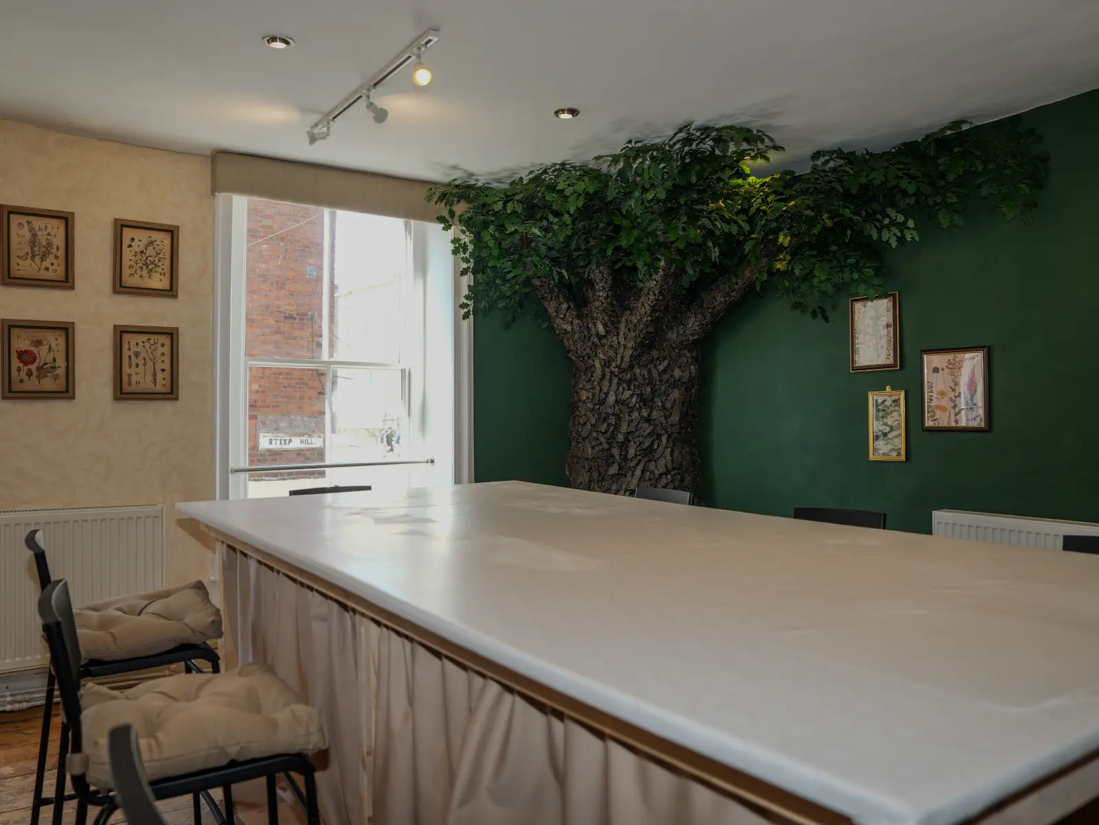 The workshop space beneath the enchanted oak, set up and waiting for guests